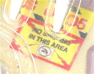 The 'No Smoking' sign on the base of the playset